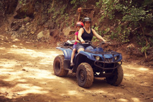 mom and daughter on ATV