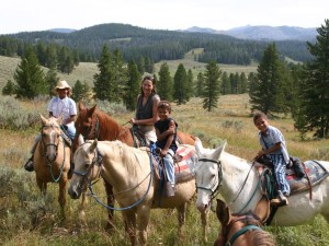 Family posing on horses on a ride in Bryce Canyon