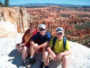 Mother and two sons posing in front of Bryce Canyon