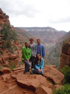 Family posing at an overlook in Utah