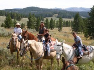 family on horses