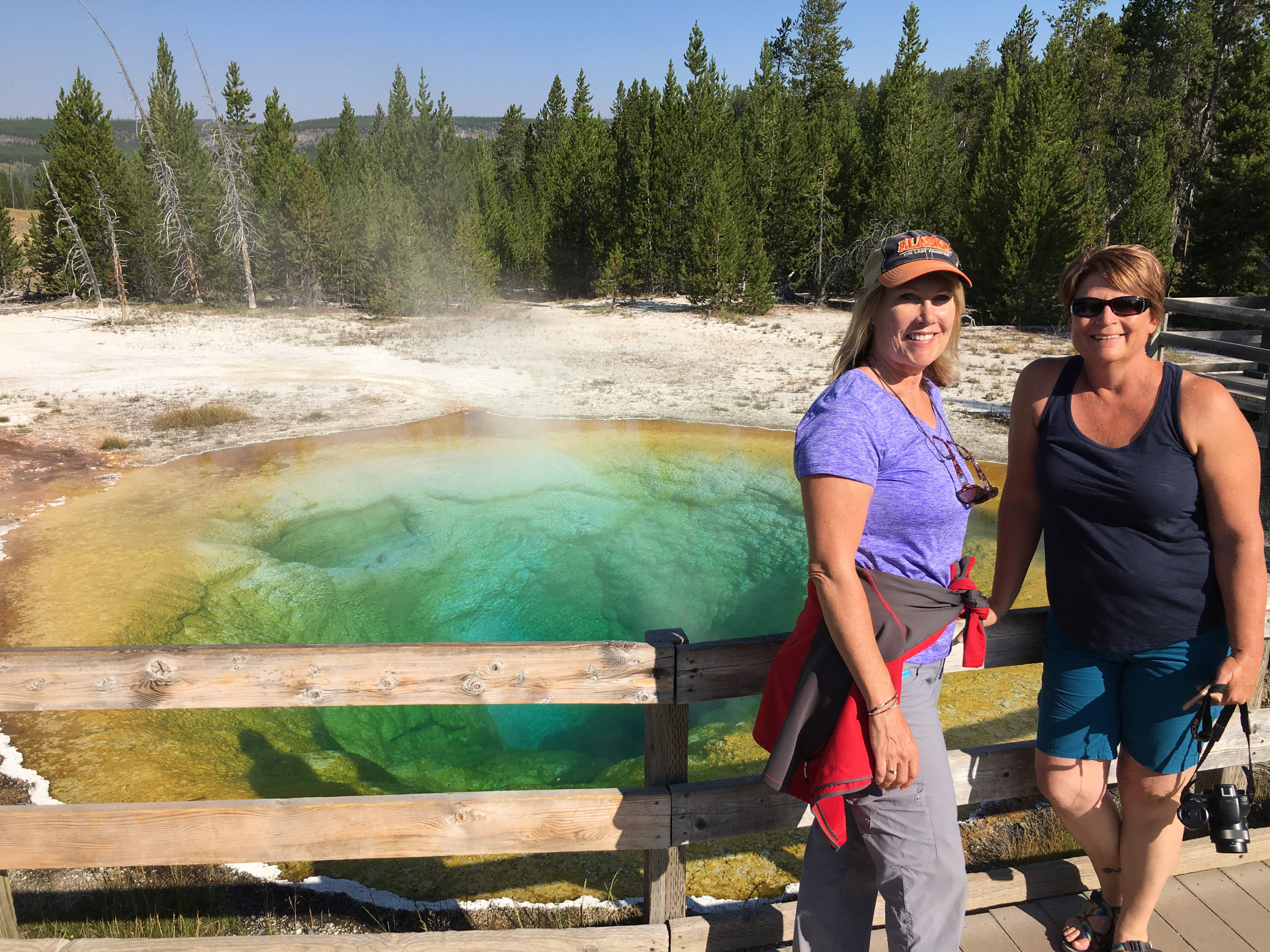 two woman standing at grand prism yellowstone