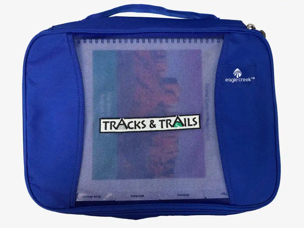 guided-rv-vacations Tracks & Trails blue bag holding pamphlets