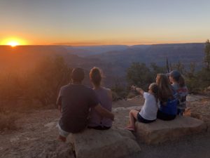 Family watching the sun set at Grand Canyon