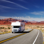 RV driving down road in southwest USA
