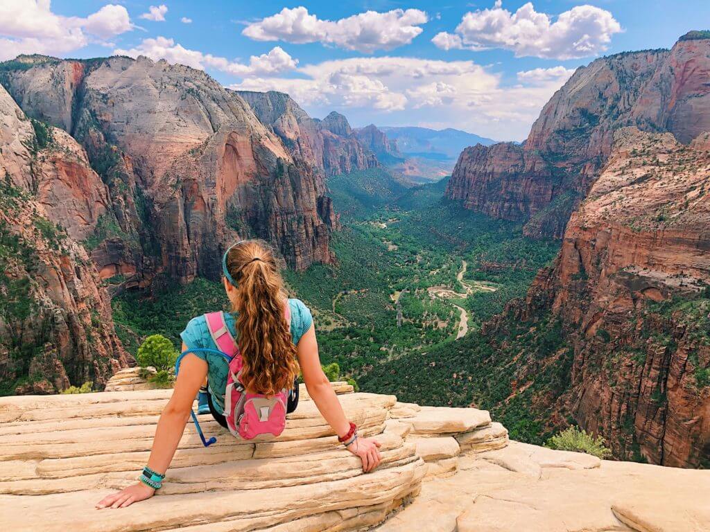 Girl looking over Zion National Park at Angels Landing