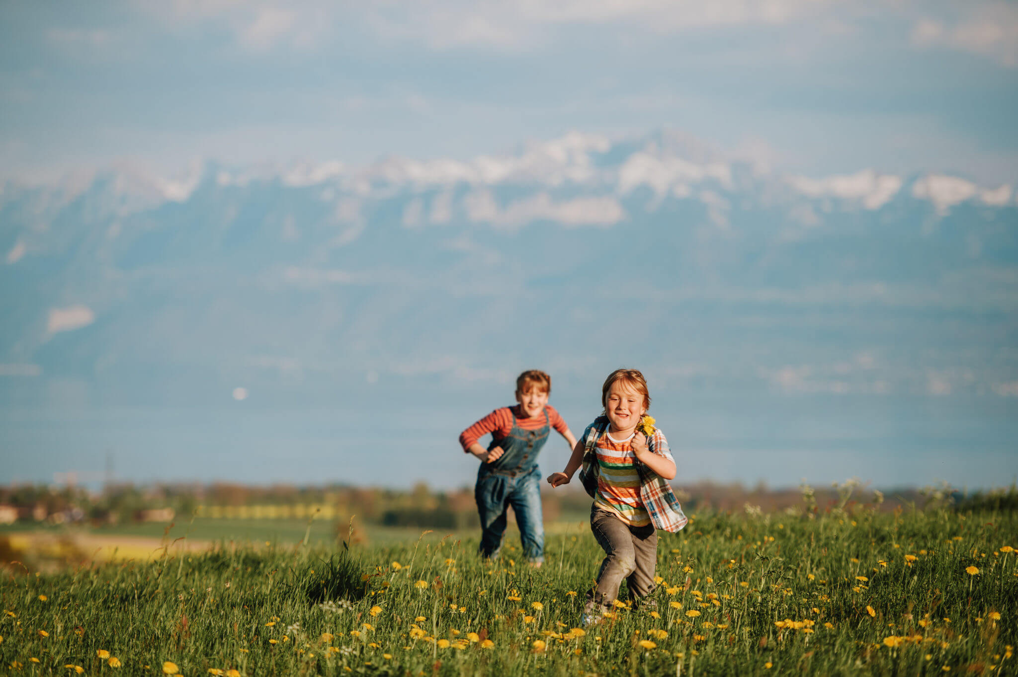 Two Kids, Little Brother And Big Sister, Playing Together Outdoors 