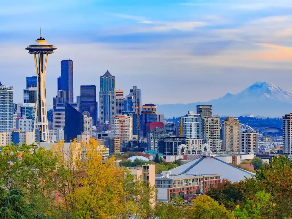 Seattle cityscape showing both the Seattle Space Needle and Mt Rainier