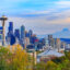 Seattle cityscape showing both the Seattle Space Needle and Mt Rainier